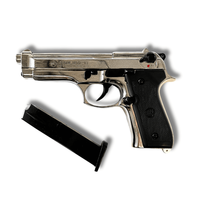 Bruni 92 9mm P.A.K Nickel C12 avec un chargeur, pistolet d’alarme haut de gamme, finition nickel et design classique.